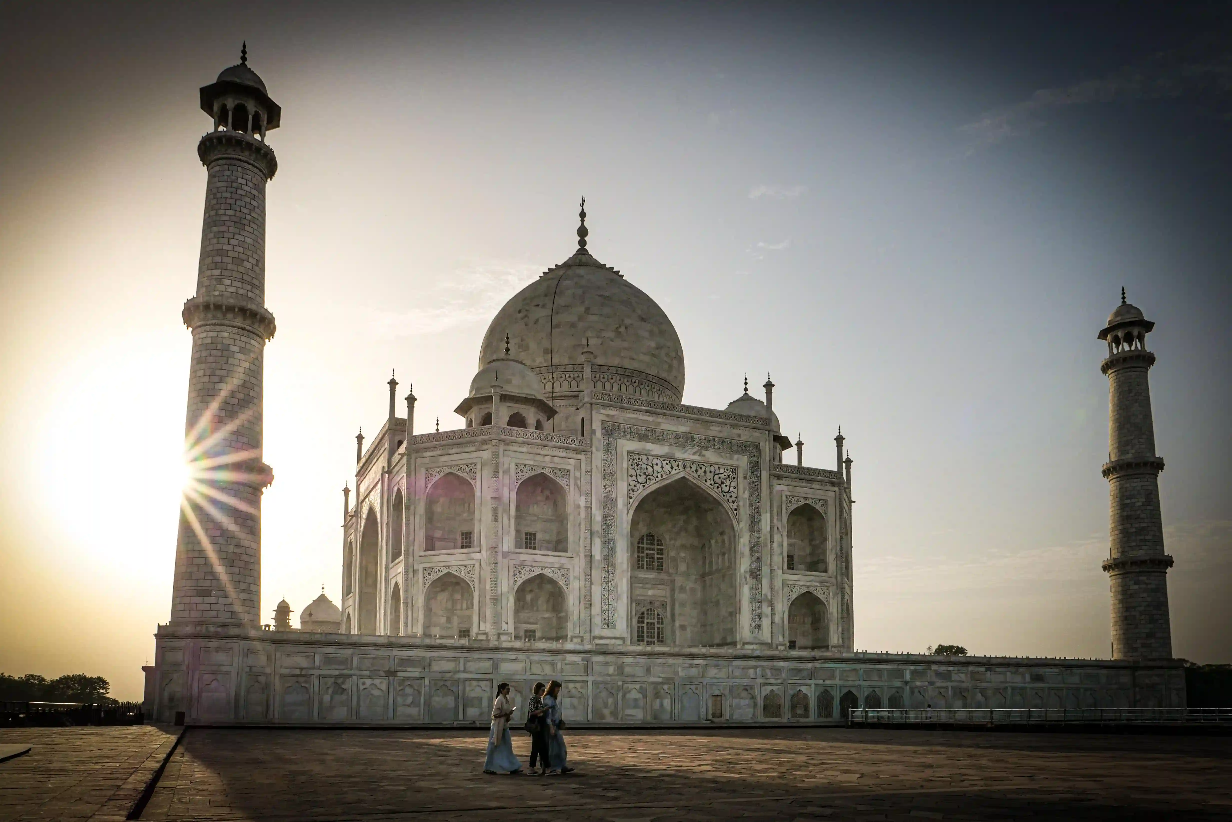Taj Mahal at sunrise &mdash; marble glowing rose-gold in the first light of morning with Kamran Khan