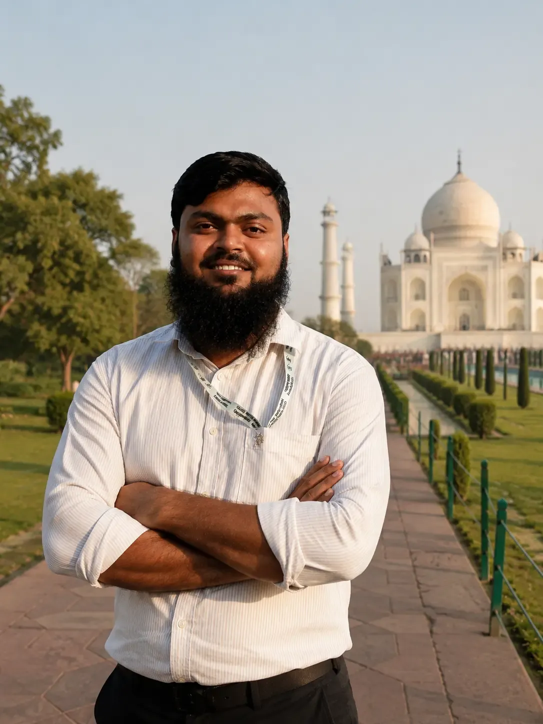 Kamran Khan, government-licensed tour guide, standing in front of the Taj Mahal