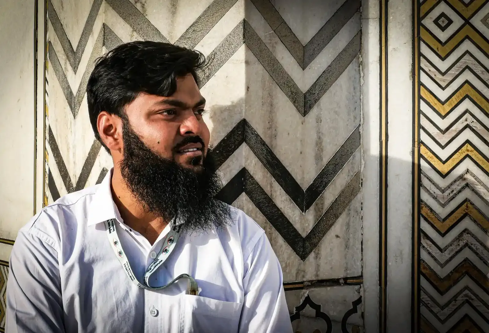 Kamran Khan beside a marble inlay panel