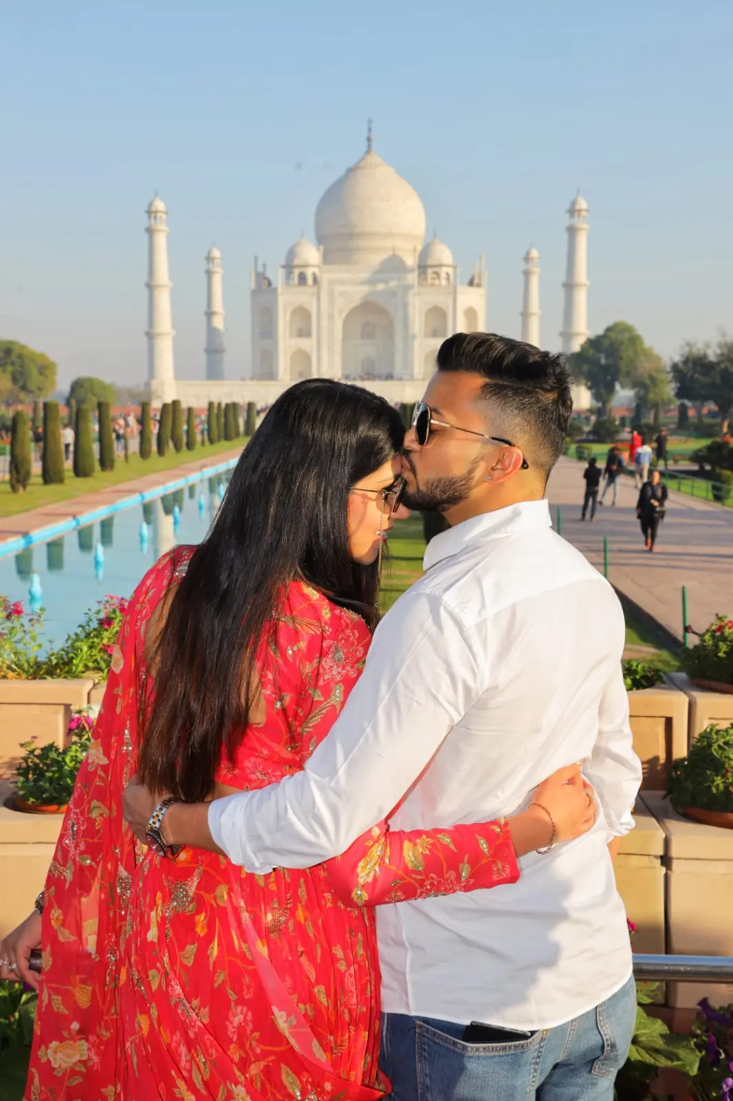 Pre-wedding couple portrait at the Taj Mahal garden pathway — Golden Hour